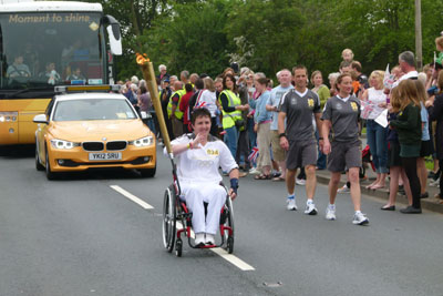 Para-archer Mel CLARKE carries the Olympic Torch | World Archery