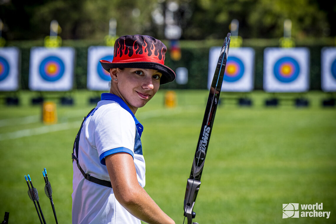 Giorgia Cesarini smiling on the shooting line at Final Olympic Qualifier.