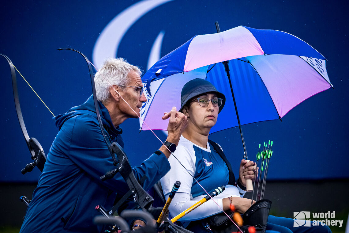 Aziza Benhami with coach at Paris 2024.