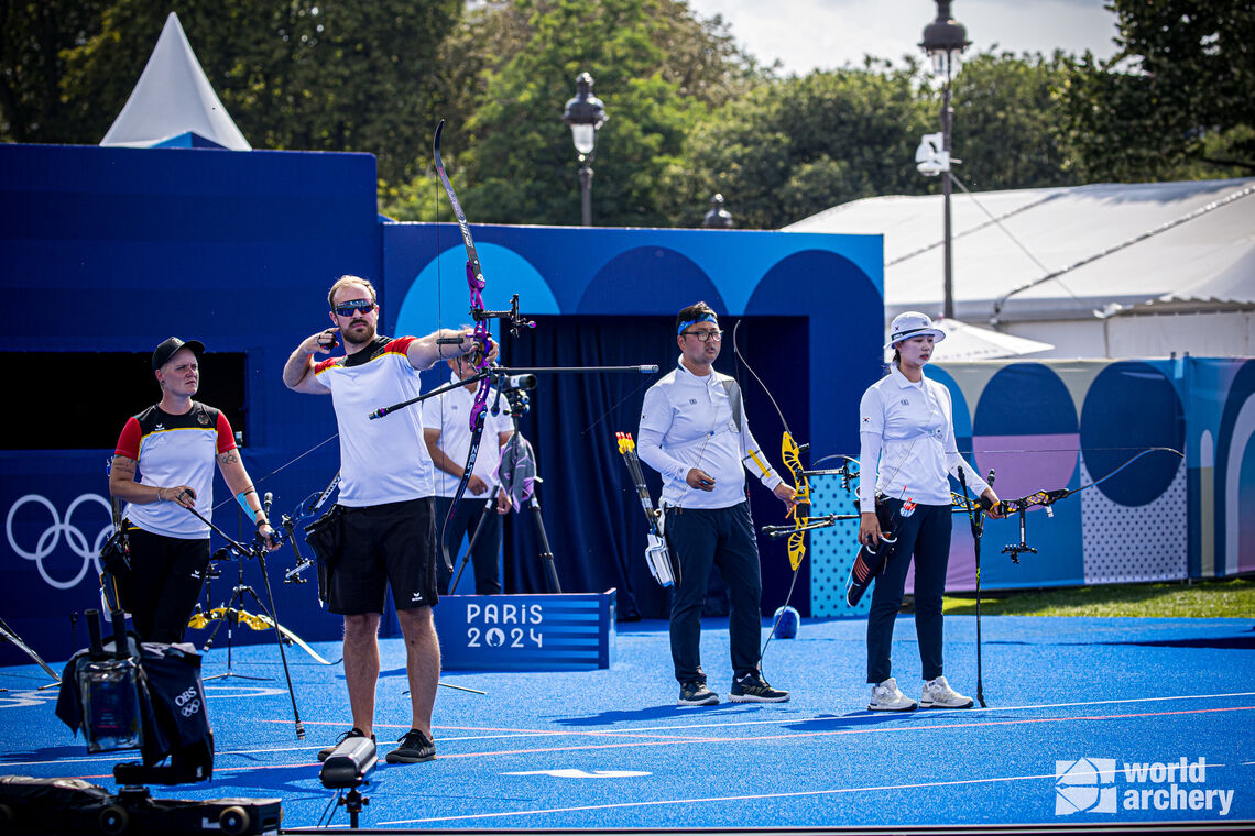 Michelle Kroppen and Florian Unruh facing Korea in mixed team gold medal match.