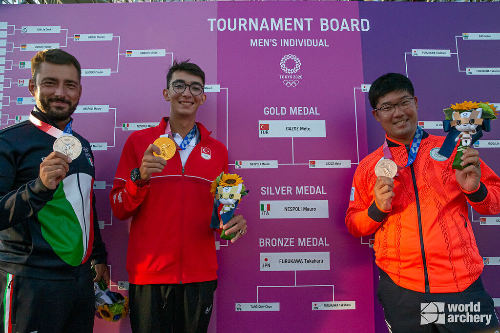 Mauro Nespoli, Mete Gazoz and Takaharu Furukawa pose with their medals at the Tokyo 2020 Olympic Games. 