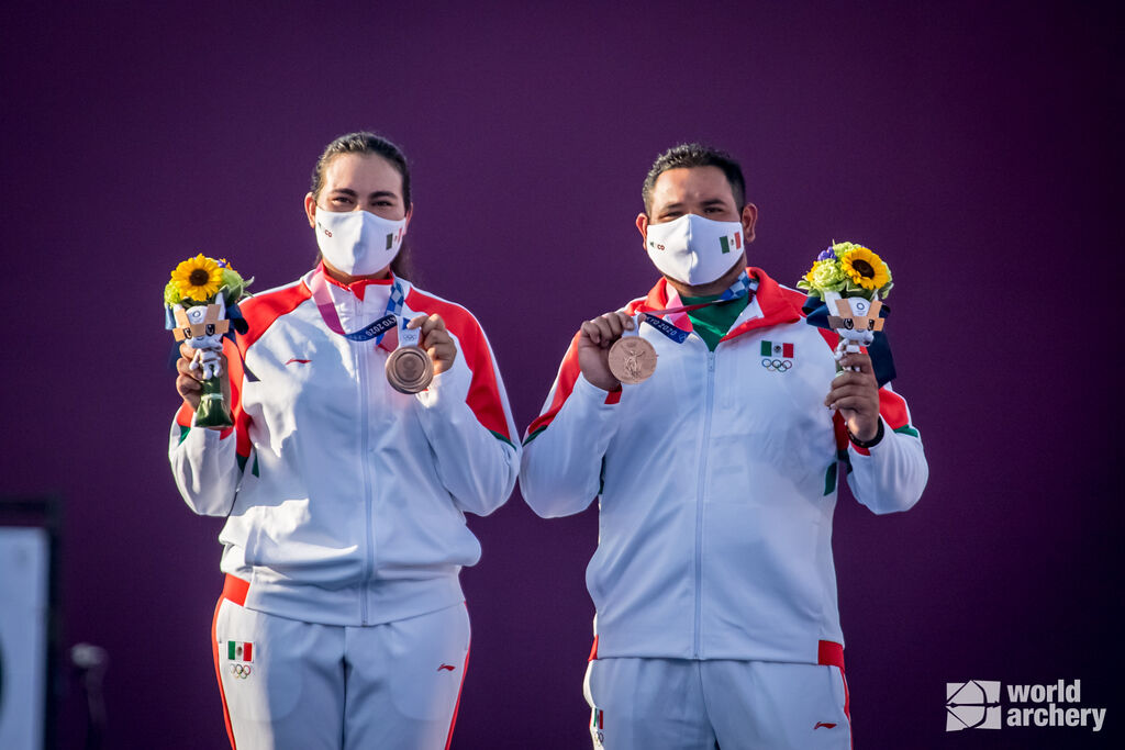 Alejandra Valencia and Luiz Alvarez celebrate winning bronze in the mixed team event at the Tokyo 2020 Olympic Games. 