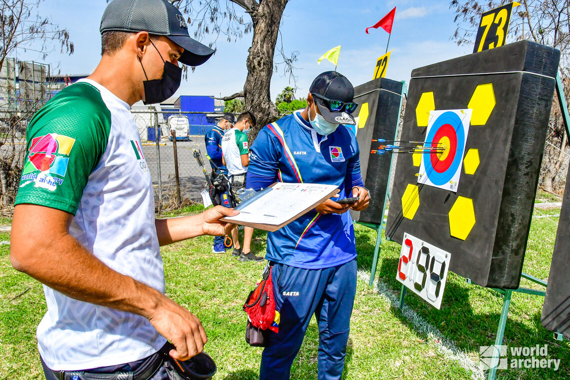 Juan Fernando Bonilla reviews his score at the 2021 Pan American Championships in Monterrey, Mexico