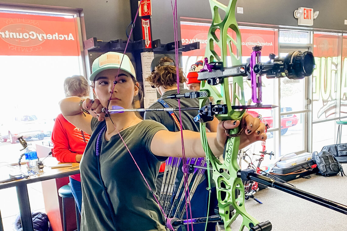 Brielle Ochnich shoots during practice for the Indoor Archery World Series Finals in 2021.