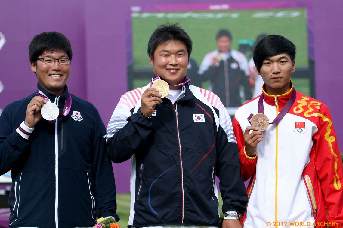 The recurve men’s podium at the Olympic Games in 2012. (Left to right: Takaharu Furukawa, Japan (silver); Oh Jin Hyek, Korea (gold); Dai Xiaoxiang, China (bronze).)