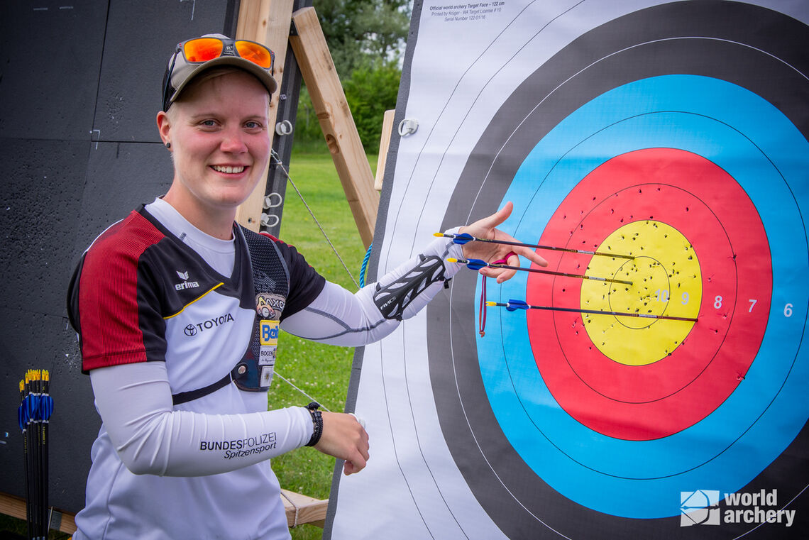 Michelle Kroppen celebrates making the recurve women's individual gold medal match at Munich 2022