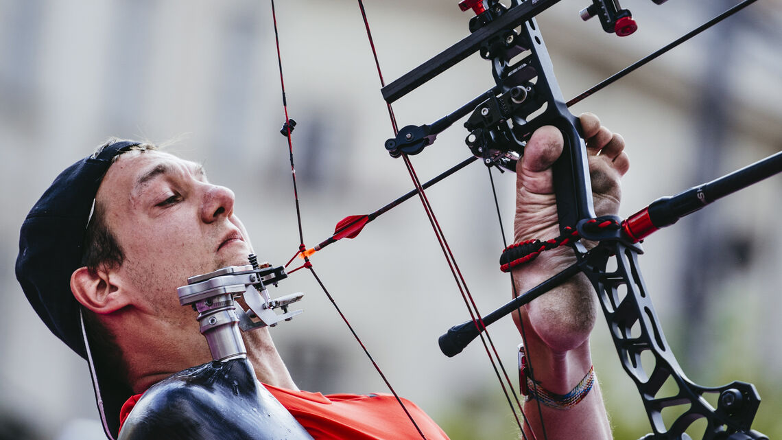 Piotr Van Montagu drawing bow during compound bronze medal match.