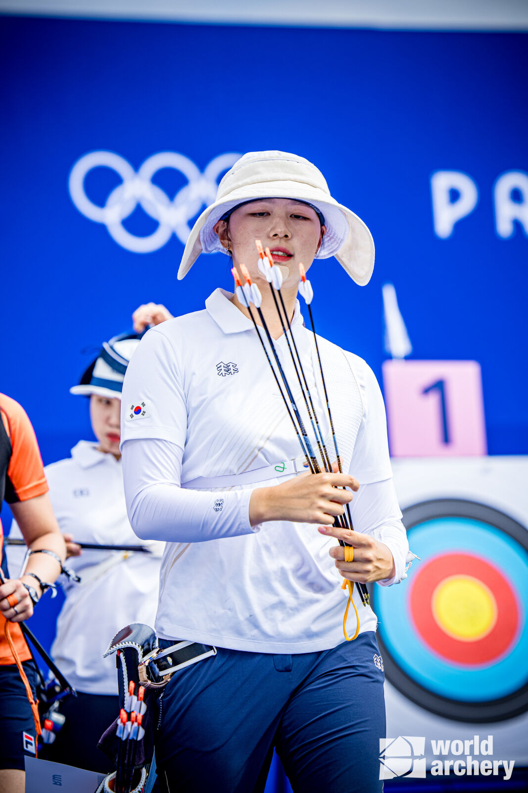 Lim Sihyeon checks her arrows midway through the qualifying round.