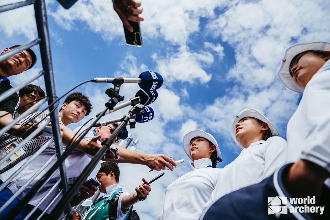 The Korean women’s team are interviewed after breaking the Olympic record.