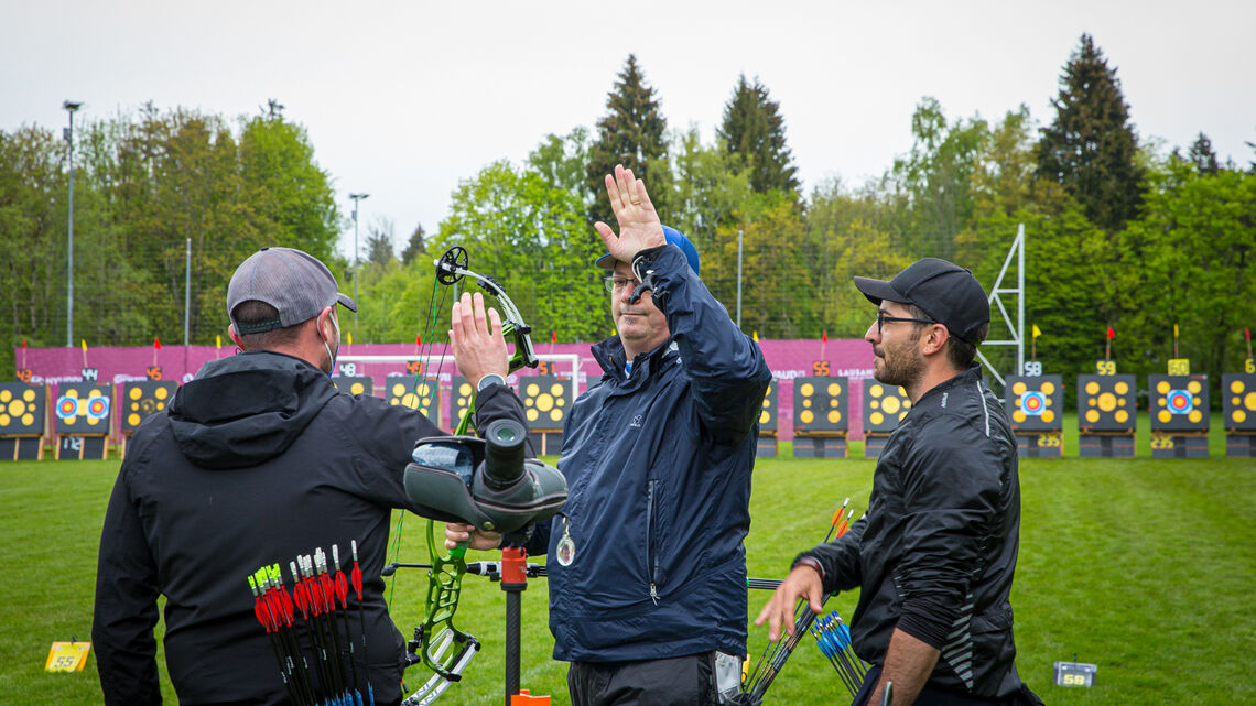 Italy celebrates taking bronze at the second stage of the 2021 Hyundai Archery World Cup in Lausanne.