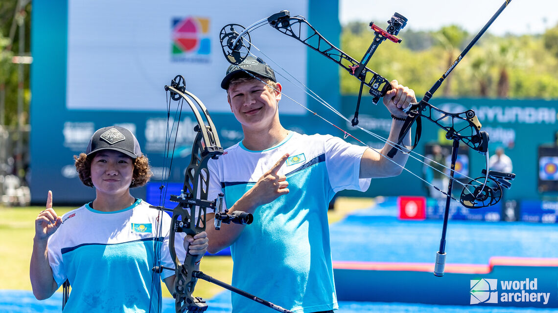Andrey Tyutyun and Adel Zxhexenbinova of Kazakhstan celebrating.