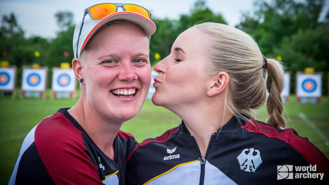 Germany's Michelle Kroppen receives a kiss from teammate, Katharina Bauer