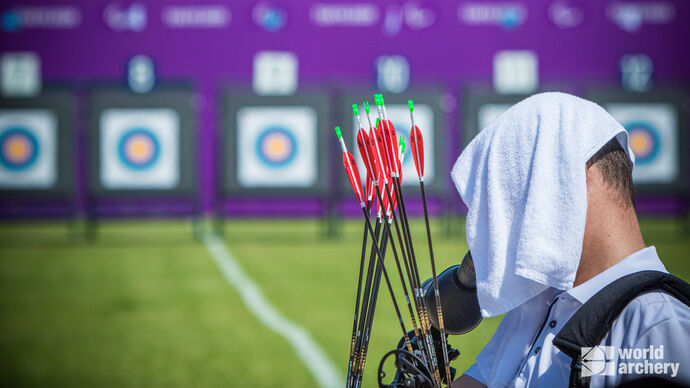 W1 archer cools off with towel at Tokyo 2020 Paralympic Games.