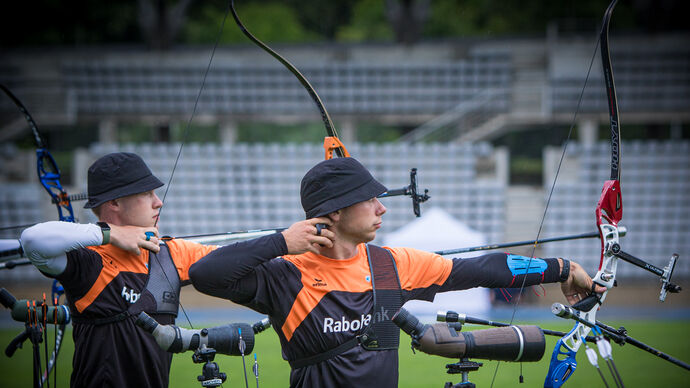 Dutch teammates Gijs Broeksma and Steve Wijler shoot at the third stage of the 2021 Hyundai Archery World Cup in Paris.