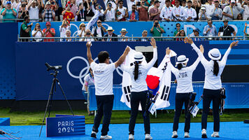 Korean women celebrate winning gold at the Paris 2024 Olympics.